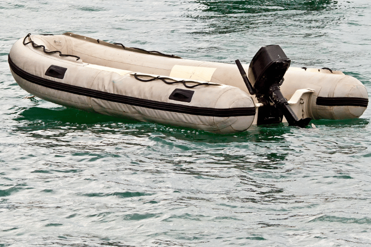 An inflatable boat on water with nobody