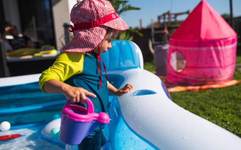 Child having fun in an inflatable pool