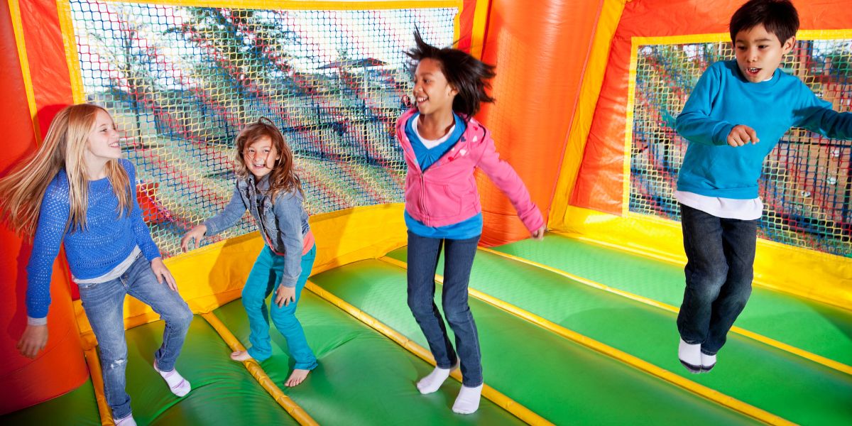 Children playing inside the bounce house