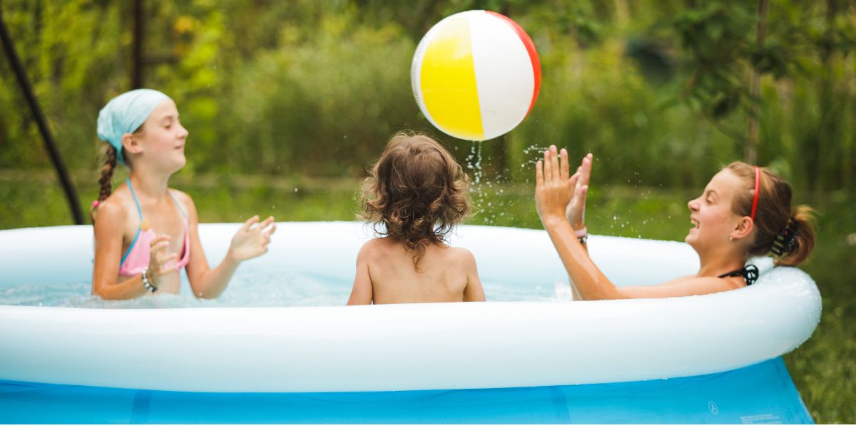 Girls playing in inflatable pool