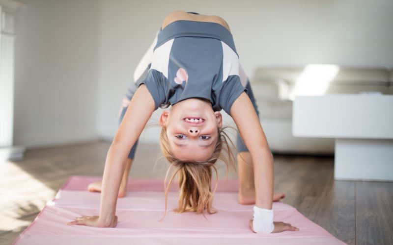 Little girl practicing gymnastics