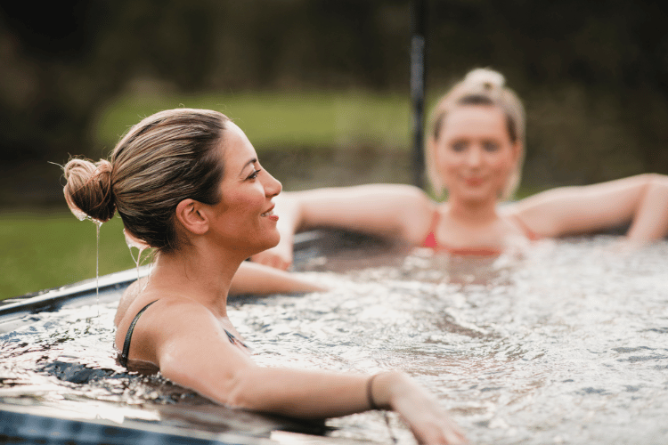 Adult women relaxing in a hot tub