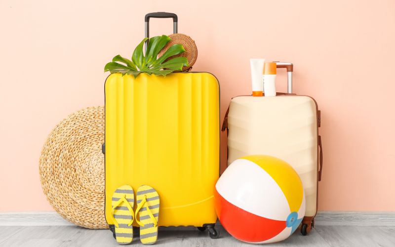 Packed Luggage with a beach ball