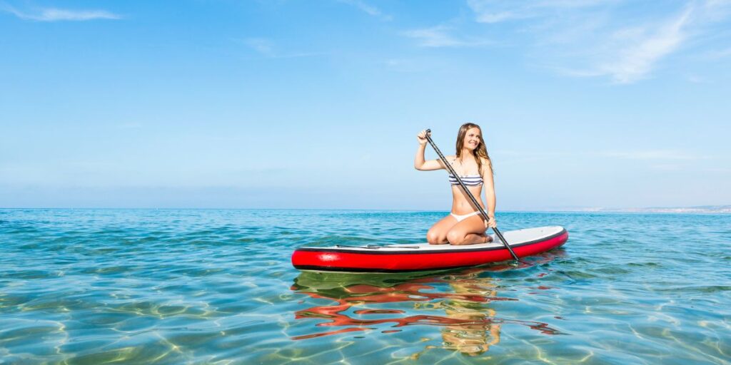 a girl on an inflatable paddle board