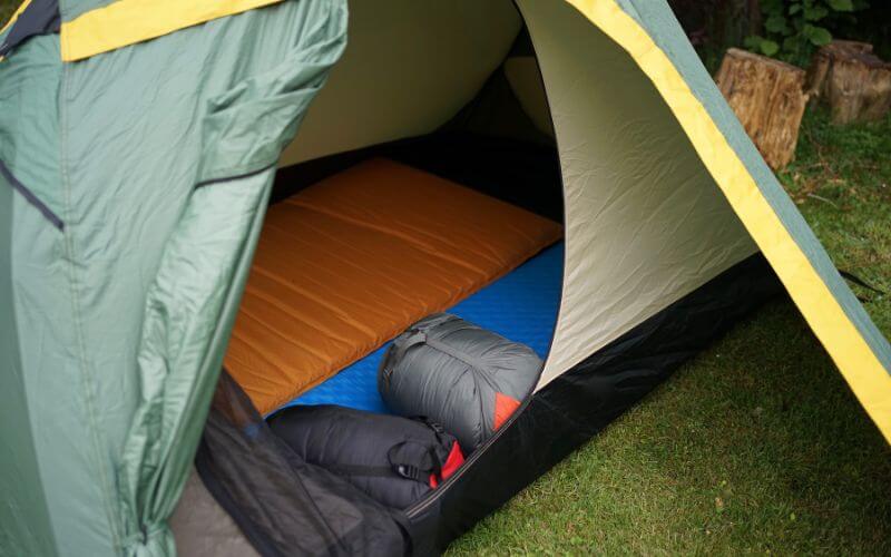 camping tent with sleeping bags and inflatable sleeping pads