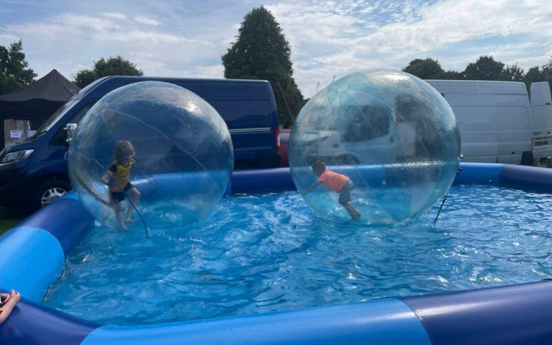 kids zorbing on water