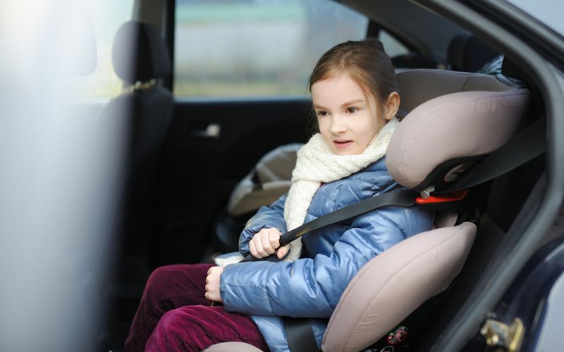 little girl inside the car