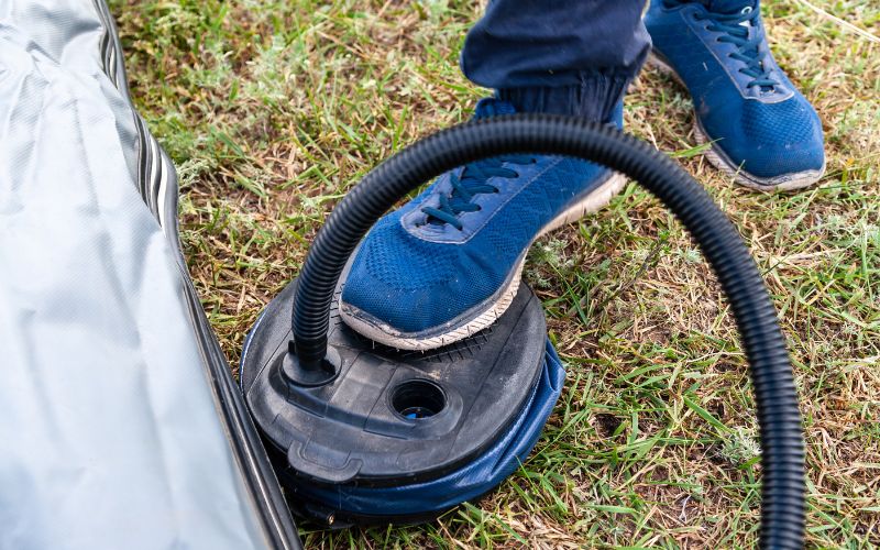 pumping an inflatable with a foot pump