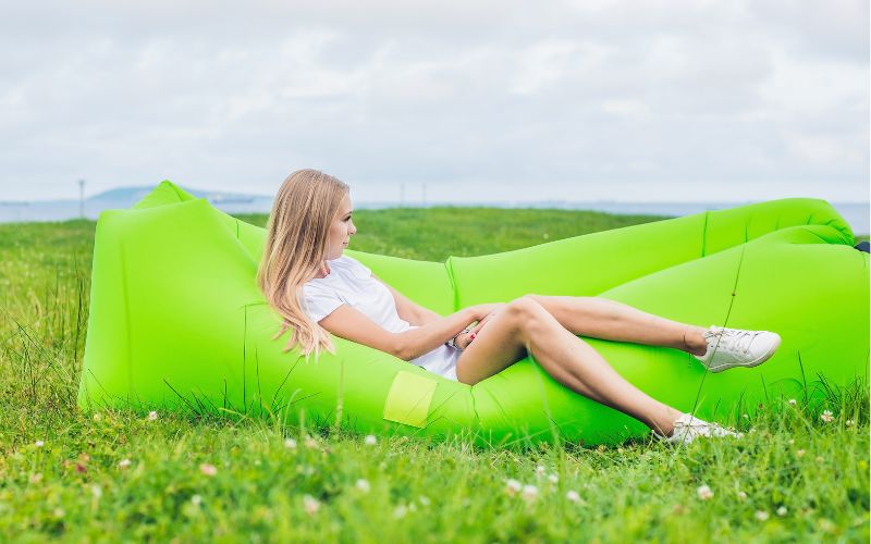 Woman resting on an inflatable sofa